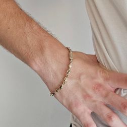 Photo of worn D&R bracelet in White and Yellow Gold