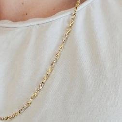 Photo of worn Yellow and White Gold 2+1 tubolar chain necklace
