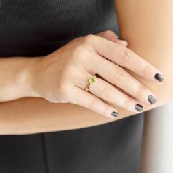 Photo of worn Open Solitaire Ring with 7mm Round Peridot and Diamond Yellow Gold