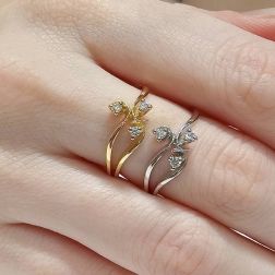 photo of worn three bands Trilogy Flower ring in White Gold and Diamonds