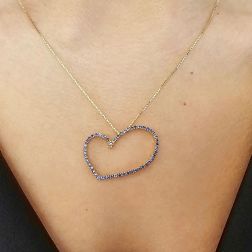 Photo of worn LOVE Necklace 54 Blue Sapphires in Yellow Gold