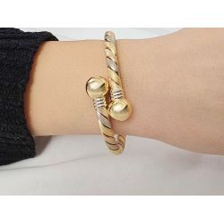 Photo of worn Rigid bracelet spiral with 2 spheres in yellow, white and rose gold