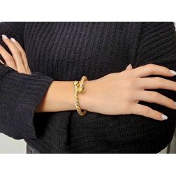 Photo of worn Rigid bracelet spiral with 2 spheres in yellow, white and rose gold