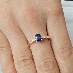 photo of worn Solitaire Ring with Octagonal Sapphire and 8 Diamonds