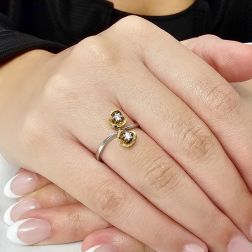Photo of worn Double Flowers Ring with diamonds on white and yellow gold