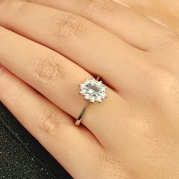 Photo of worn Kate ring with 6x4mm Acquamarine and 10 Diamonds
