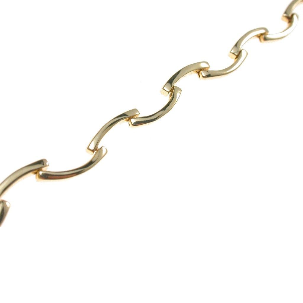Bracciale semirigido a segmenti sinuosi in Oro Giallo
