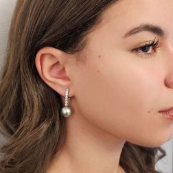Photo of worn Tennis-style earrings with 14 diamonds and 13mm Tahiti pearls