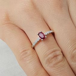 Photo of worn Oval Ruby Solitaire Ring with 8 Diamonds in White Gold