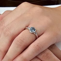 photo of worn Round Solitaire Ring with Aquamarine and 18 Diamonds White Gold
