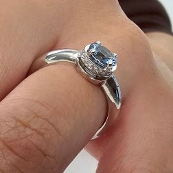 photo of worn Round Solitaire Ring with Aquamarine and 18 Diamonds White Gold