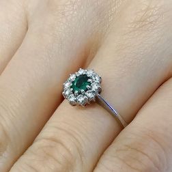 Photo of worn 5x4 Oval Emerald Solitaire Ring with 10 Diamonds