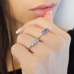 Photo of worn 4mm Tanzanite Trilogy Cruise Ring in White Gold