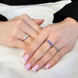 Photo of worn 4mm Tanzanite Trilogy Cruise Ring in White Gold