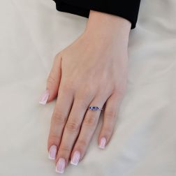 Photo of worn 4mm Tanzanite Trilogy Cruise Ring in White Gold