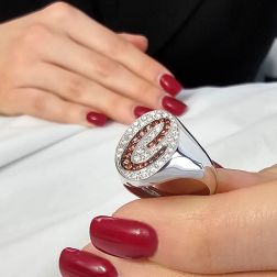 Photo of worn Letter C Chevalier Ring with Mandarin Sapphires and Diamonds