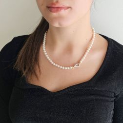 Photo of worn Akoya pearl necklace with drop clasp in White and Rose Gold with Diamonds