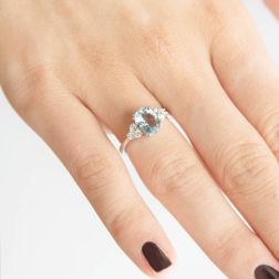 Photo of worn Solitaire Ring with Aquamarine 9mmx7mm and Diamonds