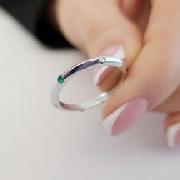 Photo of worn Thin pyramid-shaped ring with alternating diamonds, blue sapphires, rubies and emeralds