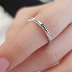 Photo of worn Thin pyramid-shaped ring with alternating diamonds, blue sapphires, rubies and emeralds