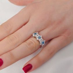 photo of worn  Trilogy Diamonds and Blue Diamonds Flower Ring