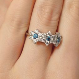 photo of worn  Trilogy Diamonds and Blue Diamonds Flower Ring