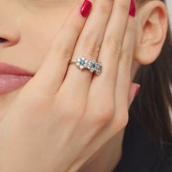 photo of worn  Trilogy Diamonds and Blue Diamonds Flower Ring