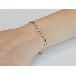 Photo of worn Ovals with Triangles Bracelet in Yellow and White Gold