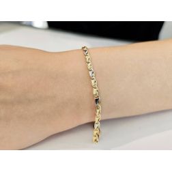 Photo of worn Ovals with Triangles Bracelet in Yellow and White Gold