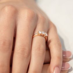 photo of worn Cross-Vault Trilogy Ring in Rose Gold with GIA certified Diamonds