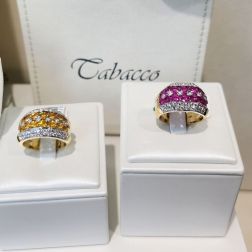 Banded design ring with 14 Pink Sapphires and 50 Diamonds