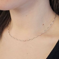 Photo of worn Wavy Semirigid flexible faceted necklace in white gold