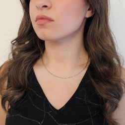 Photo of worn 1.50mm Tubular Semirigid flexible faceted necklace in white gold