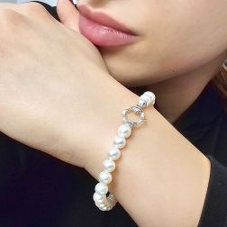 photo of worn 6-6.50mm Fresh Water pearls Bracelet with 18kt White Gold Flower clasp
