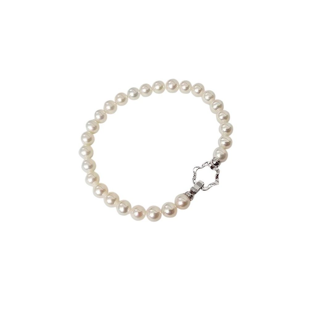 Bracciale Perle Fresh Water 6-6.50mm chiusura fiore Oro Bianco 18kt