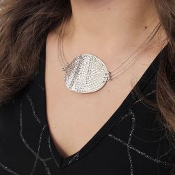photo of worn Semi-rigid curved medallion necklace in white gold