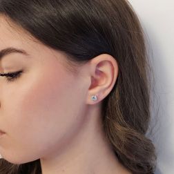 Photo of worn Solitary Studs earrings with round 5.80mm acquamarines in 18kt white gold