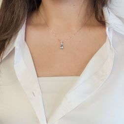 photo of worn Aquamarine teardrop necklace with 2 Diamond light points