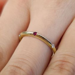 Photo of worn Thin Pyramid Band with Diamonds, Blue Sapphire, Ruby, Emerald on Yellow Gold