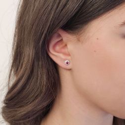 Photo of worn Point of Light Earrings with Rubies and 24 Diamonds