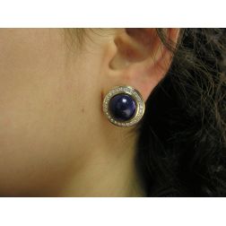 Photo of worn Round Cabochon Lapis earrings with a Diamond border Bi-colour