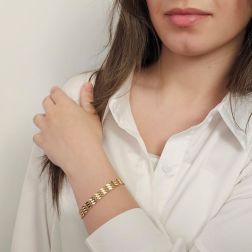 photo of worn Segmented Bracelet with Leaf Motifs and Twisted Chain in Yellow Gold