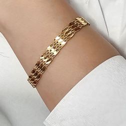 photo of worn Segmented Bracelet with Leaf Motifs and Twisted Chain in Yellow Gold