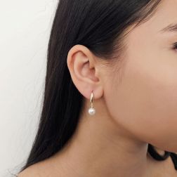 photo of worn Classic Hook Earrings 7.5mm Freshwater Pearl in Yellow Gold