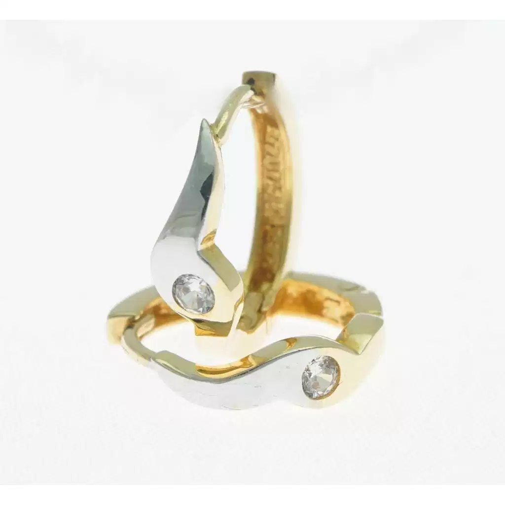 Wave small hoops in yellow and white gold