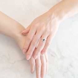 Photo of worn Kate Small Sapphire Ring 6x4mm with 10 Diamonds