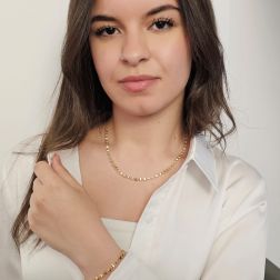 Photo of worn Three-dimensional trapezoid necklace in yellow gold