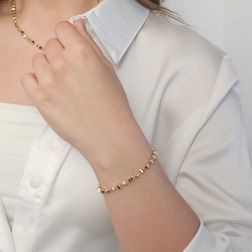 Photo of worn Three-dimensional trapezium-shaped bracelet in yellow gold