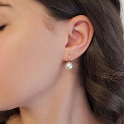 Photo of worn 9.5mm Akoya Pearl Classic Hook Earrings in Yellow Gold