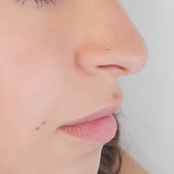 Photo of worn White gold and Diamond Nose piercing
